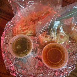 Taqueria y Pupuseria Tita - This is how they came on a regular disposable plates with aluminum foil. You have a red sauce, your green sauce, and your pickled cabbage.