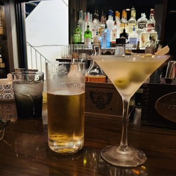 Avvino - two glasses of alcohol on a bar - New American Near Me - Rochester, New York