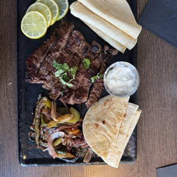 Jekyll & Hyde - Steak fajitas - skirt steak- garlic lime crema, with blistered peppers and onions, warm tortillas.  Amazing! - Mexican Near Me - St. Louis, Missouri