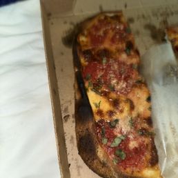 Grandma's pizza was very burned.
