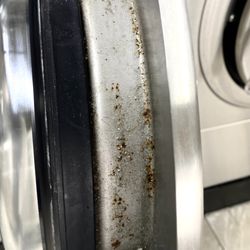 Blue Wave Laundromat - Inside rim of one of the newer washers.  Often caked with hair and grime.
