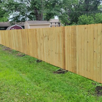 Yard Inspirations - a wooden fence in a backyard - Fences & Gates Near Me Yard Inspirations - a wooden fence in a backyard - Fences & Gates Near Me