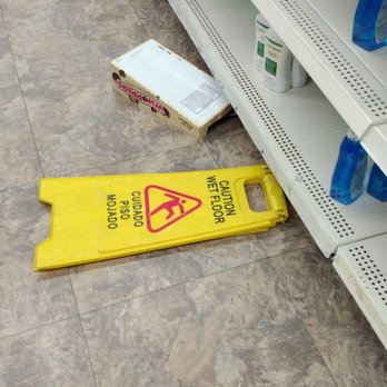Dollar Tree - Hazard warnings become a tripping hazard themselves. - Discount Store Near Me - Delray Beach, Florida