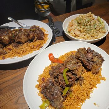 Zeke's Kitchen & Bar - oxtail entree and rasta pasta - New American Near Me - Smyrna, Georgia Zeke's Kitchen & Bar - oxtail entree and rasta pasta - New American Near Me - Smyrna, Georgia