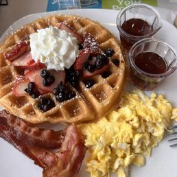 Berry waffle, eggs and bacon