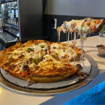 Crave Pizza - Butter Crust Pizza with sausage, onions, peppers, artichokes, pineapple, and banana peppers - Pizza Near Me - Mesa, Arizona Crave Pizza - Butter Crust Pizza with sausage, onions, peppers, artichokes, pineapple, and banana peppers - Pizza Near Me - Mesa, Arizona