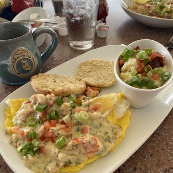 Another Broken Egg Cafe - Lobster & Brie omelet with city grits - Breakfast & Brunch Near Me - Panama City Beach, Florida Another Broken Egg Cafe - Lobster & Brie omelet with city grits - Breakfast & Brunch Near Me - Panama City Beach, Florida