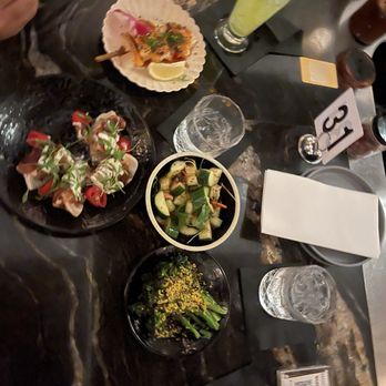 The Moderne - Sea bass, shrimp and crab dumplings, cucumber salad, and broccolini - Tapas/Small Plates Near Me - Orlando, Florida