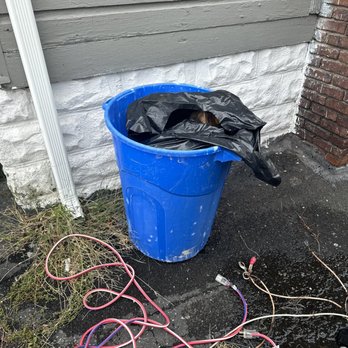 Arberia Group GC - a blue bucket with a black bag in it - Fences & Gates Near Me - Little Ferry, New Jersey