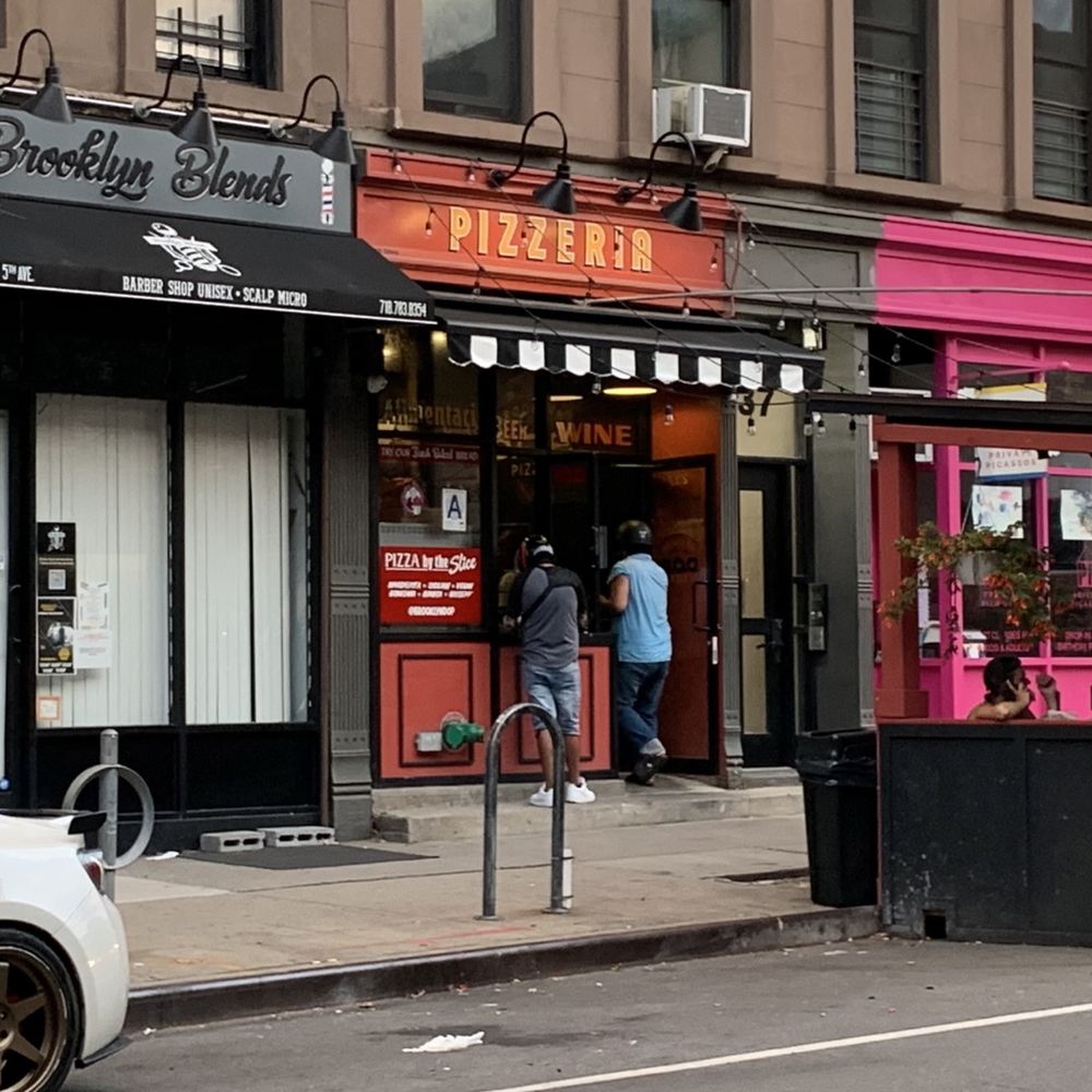 Brooklyn DOP - people walking in front of a pizza shop - Pizza Near Me - Brooklyn, New York Brooklyn DOP - people walking in front of a pizza shop - Pizza Near Me - Brooklyn, New York
