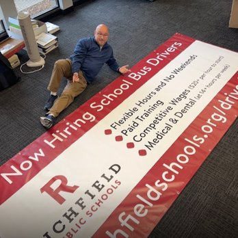 Minuteman Press - Owner with a large banner completed for Richfield Public Schools - Printing Services Near Me - Edina, Minnesota Minuteman Press - Owner with a large banner completed for Richfield Public Schools - Printing Services Near Me - Edina, Minnesota