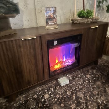 Blend Co - Electric fireplace and plugs pov from sitting on one of the couches in the large back area - Coffee & Tea Near Me - Denver, Colorado