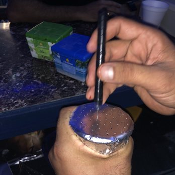 Babyloon Hookah Lounge - a person holding a knife and a cup - Hookah Bars Near Me - Philadelphia, Pennsylvania Babyloon Hookah Lounge - a person holding a knife and a cup - Hookah Bars Near Me - Philadelphia, Pennsylvania