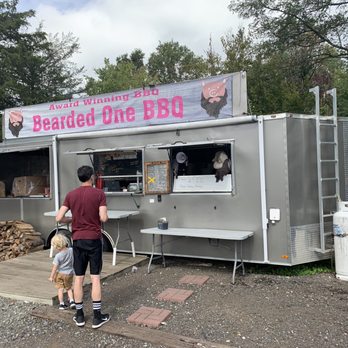 Bearded One BBQ - a man and a child standing in front of a food truck - Food Trucks Near Me - Monroe Township, New Jersey