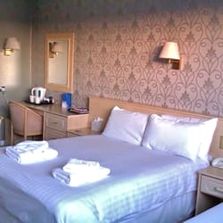 New Kent - Double bed and dressing table/desk, family room, New Kent Hotel.