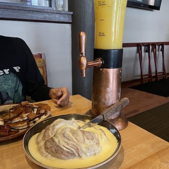 Sundance Grill - a person sitting at a table with food - Bars Near Me - Grand Rapids, Michigan Sundance Grill - a person sitting at a table with food - Bars Near Me - Grand Rapids, Michigan