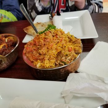 Kurry Houzz & Grill - a person eating a meal - Indian Near Me - Chatham-Kent, Ontario