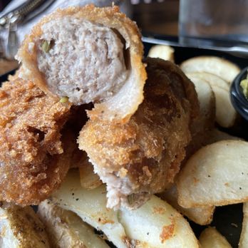 Cheeky Bastards - Battered sausage and chips with side of mushy peas - Breakfast & Brunch Near Me - Indianapolis, Indiana Cheeky Bastards - Battered sausage and chips with side of mushy peas - Breakfast & Brunch Near Me - Indianapolis, Indiana