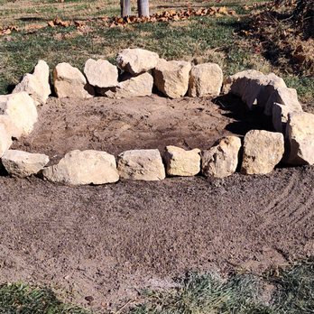 Holmes Outdoor Service - a fire pit made of rocks - Landscaping Near Me - Alton, Illinois Holmes Outdoor Service - a fire pit made of rocks - Landscaping Near Me - Alton, Illinois