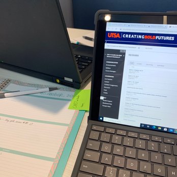 Blue Baker - a laptop and notebook on a desk - Pizza Near Me - College Station, Texas Blue Baker - a laptop and notebook on a desk - Pizza Near Me - College Station, Texas