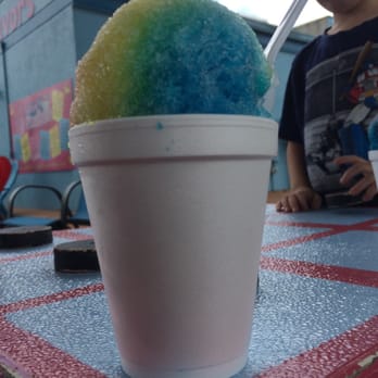 Pelican's Sno Balls - a child sitting at a table - Ice Cream & Frozen Yogurt Near Me - Shelby, North Carolina Pelican's Sno Balls - a child sitting at a table - Ice Cream & Frozen Yogurt Near Me - Shelby, North Carolina