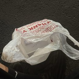 Eating on the ground outside the restaurant lol