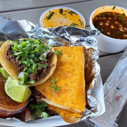 Tacos El Primo - A lone, regular taco sitting atop the Mega Quesabirria.