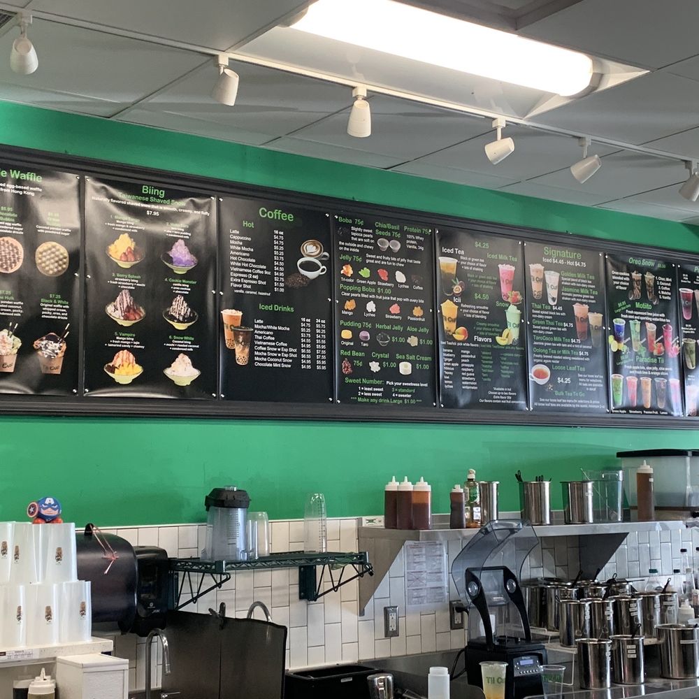 a menu board and coffee machines a menu board and coffee machines