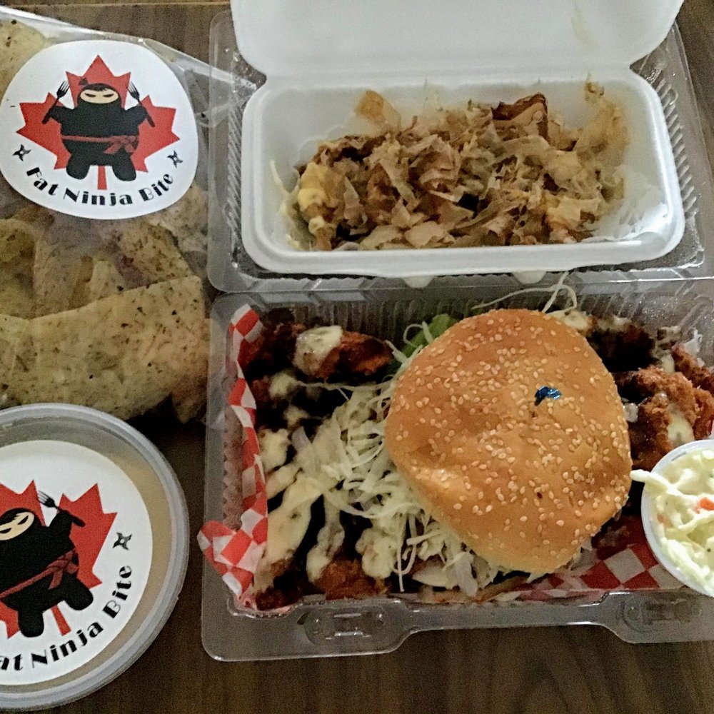 Fat Ninja Bite - Top left going clockwise: taro chips, beef dumplings, chicken katsu burger with coleslaw, and a generous container of yeast for baking - Japanese Near Me - Toronto, Ontario Fat Ninja Bite - Top left going clockwise: taro chips, beef dumplings, chicken katsu burger with coleslaw, and a generous container of yeast for baking - Japanese Near Me - Toronto, Ontario