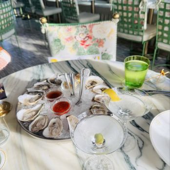 The Marigold Club - Dozen oysters with 2 added boops of caviar, marigold martini and Mayfair martini - American Near Me - Houston, Texas The Marigold Club - Dozen oysters with 2 added boops of caviar, marigold martini and Mayfair martini - American Near Me - Houston, Texas