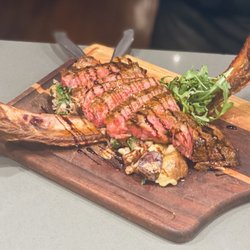 Chef Dan Lane’s Culinary Experience - Grilled tomahawk steak over duck confit potatoes, mushrooms,wilted arugula &balsamic glaze