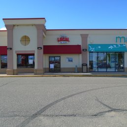 Entrance is on the right side of the bowling alley, view looking north.