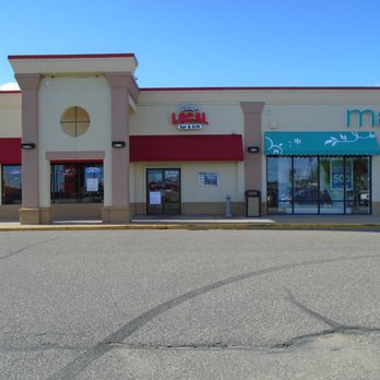 Jonesy's Local Bar & Grill - Entrance is on the right side of the bowling alley, view looking north. - Sports Bars Near Me - Hudson, Wisconsin
