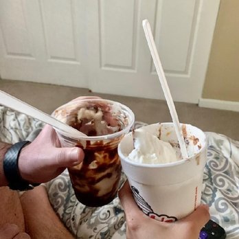 Flubs Dari Ette - a person holding two cups of ice cream and a spoon - Ice Cream & Frozen Yogurt Near Me - Fairfield, Ohio
