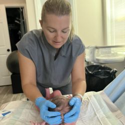 Charisma Midwifery - Examining baby after birth