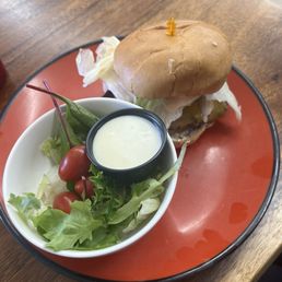 Basic cheeseburger with side salad. Basic cheeseburger with side salad.