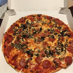 Pepperoni, mushroom and black olive pizza. Pepperoni, mushroom and black olive pizza.