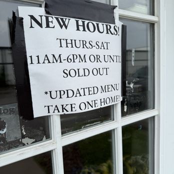5 Thumbs BBQ - A printed sign taped to a window displays updated business hours and a take-one menu option. - Barbeque Near Me - Indianapolis, Indiana