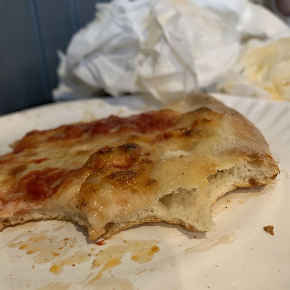 Denino's South Pizzeria - a half eaten pizza - Pizza Near Me - Brick, New Jersey Denino's South Pizzeria - a half eaten pizza - Pizza Near Me - Brick, New Jersey