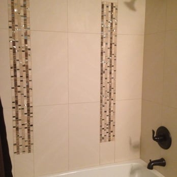 Discount Tile Outlet - Mindy's design utilizing a remnant quantity of usually very expensive tile to make a plain tub enclosure sparkle! - Kitchen & Bath Near Me - Bellevue, Washington