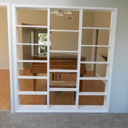 There were ugly old windows in this spot. Now my see through Bookcase!