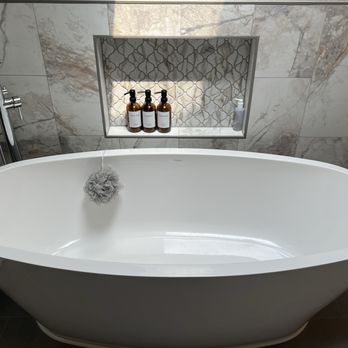 Harding Construction - Freestanding tub with tile work detail and faucet - General Contractors Near Me
