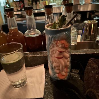 Fresh Kills Bar - a glass of water and a bottle of liquor - Cocktail Bars Near Me - Brooklyn, New York Fresh Kills Bar - a glass of water and a bottle of liquor - Cocktail Bars Near Me - Brooklyn, New York