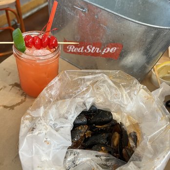 Angry Crab Shack - Hurricane Drink half off for happy hour and Mussels $13 per lb - Seafood Near Me - Orange Beach, Alabama Angry Crab Shack - Hurricane Drink half off for happy hour and Mussels $13 per lb - Seafood Near Me - Orange Beach, Alabama