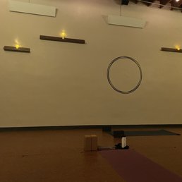 a yoga room with a yoga mat and candles a yoga room with a yoga mat and candles