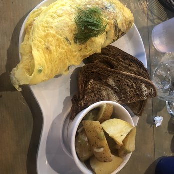 Two Chicks Cafe - Under the Sea Omelette with potatoes and rye toast - Breakfast & Brunch Near Me - New Orleans, Louisiana Two Chicks Cafe - Under the Sea Omelette with potatoes and rye toast - Breakfast & Brunch Near Me - New Orleans, Louisiana