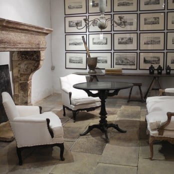 Chateau Domingue - a living room with a fireplace - Flooring Near Me - Houston, Texas Chateau Domingue - a living room with a fireplace - Flooring Near Me - Houston, Texas