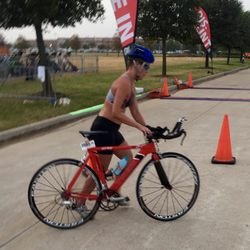 YMCA of Natrona County - Local Olympic triathlon in Houston, coming out of the water and onto the bike.