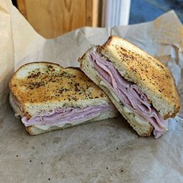 two halves of a ham and cheese sandwich