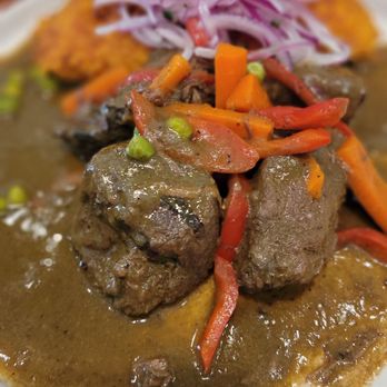 Inka Grill - Frijol con seco Tender pieces of beef slowly cooked with onions, cilantro, dark beer, Peruvian peppers - Peruvian Near Me - Greensboro, North Carolina Inka Grill - Frijol con seco Tender pieces of beef slowly cooked with onions, cilantro, dark beer, Peruvian peppers - Peruvian Near Me - Greensboro, North Carolina